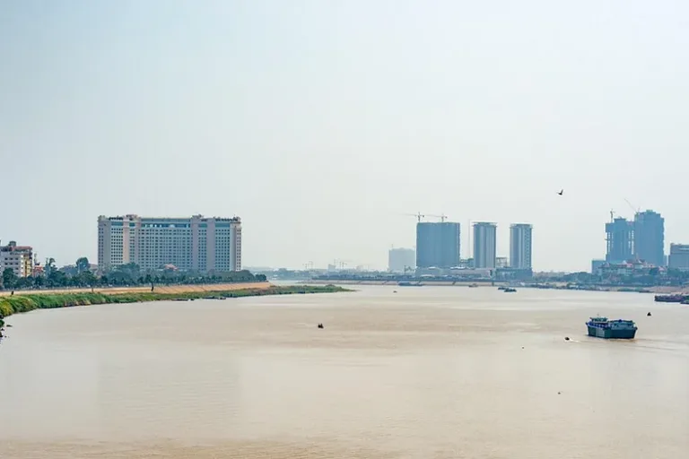 A wide river and distant buildings in Phnom Penh.