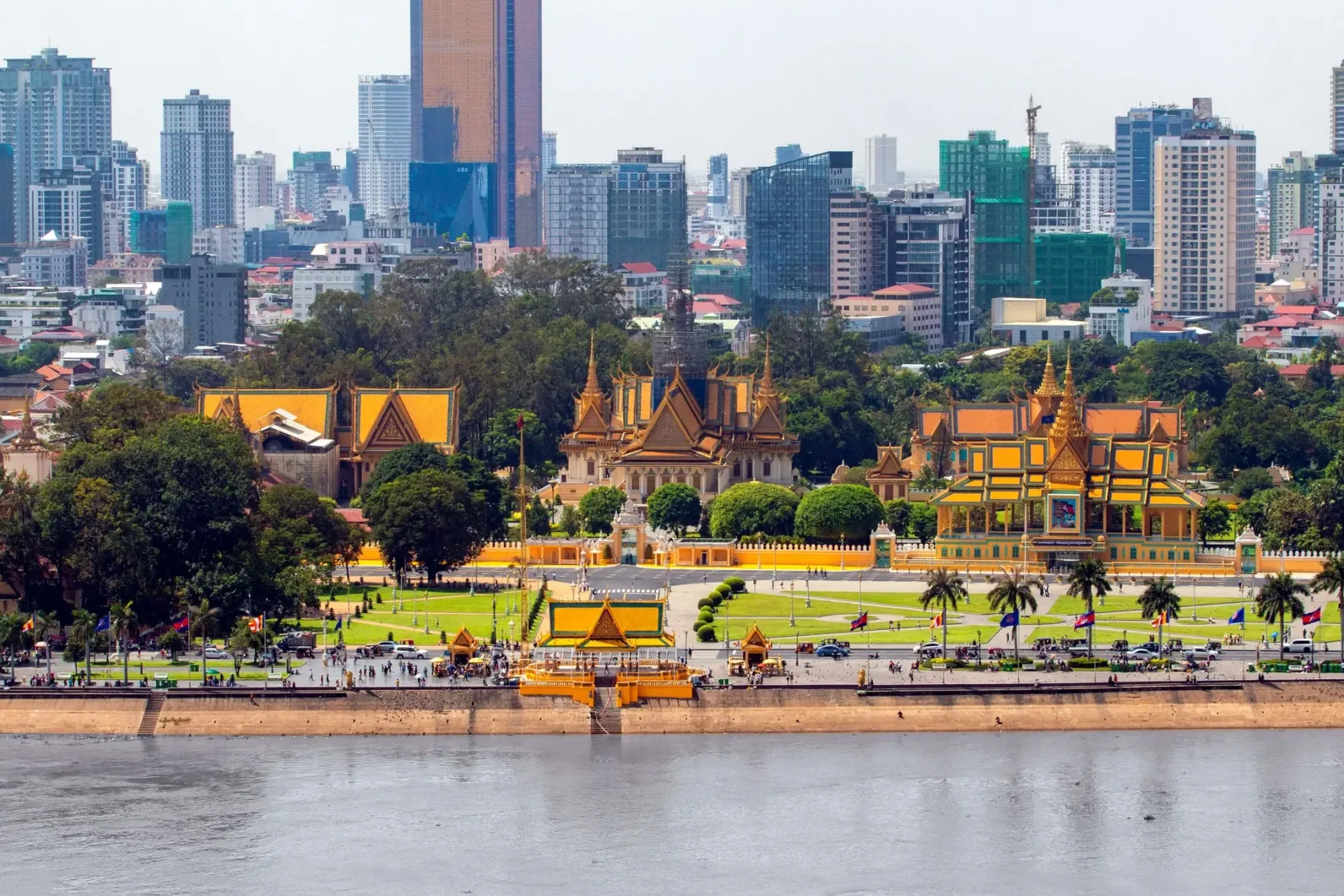 Phnom Penh's Royal Palace and skyline seen across the river.